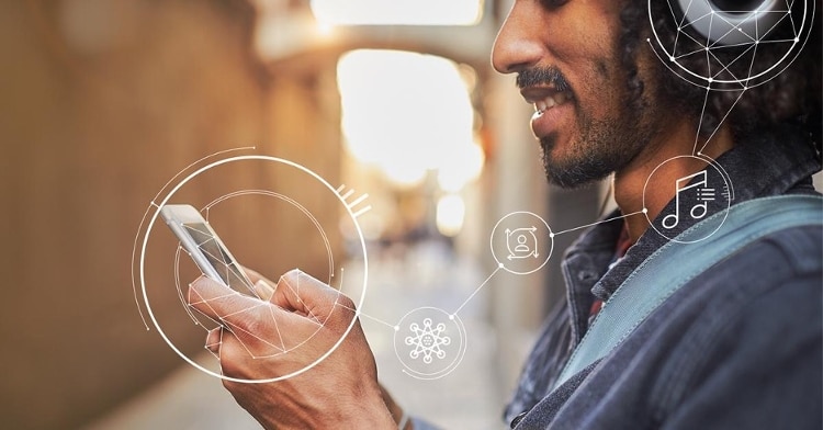 man holding iphone and wearing black headphones with white music vector icons connecting the 2 devices