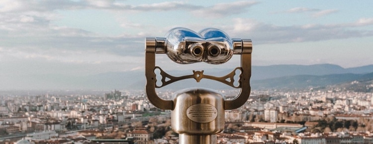 A pair of binoculaurs overlooking a city