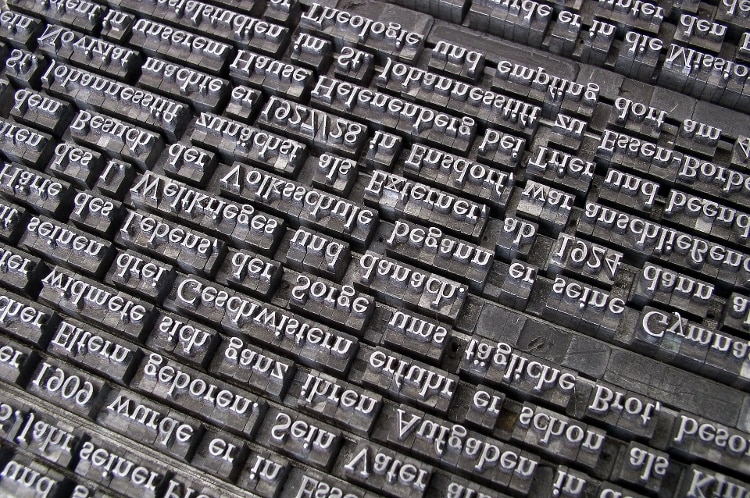 upside down stainless steel printing press keys with white text