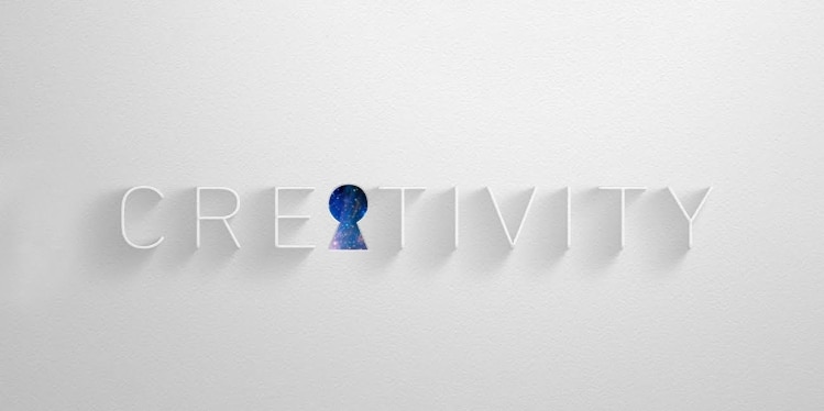 "Creativity" written out, with the "A" as a punched out keyhole