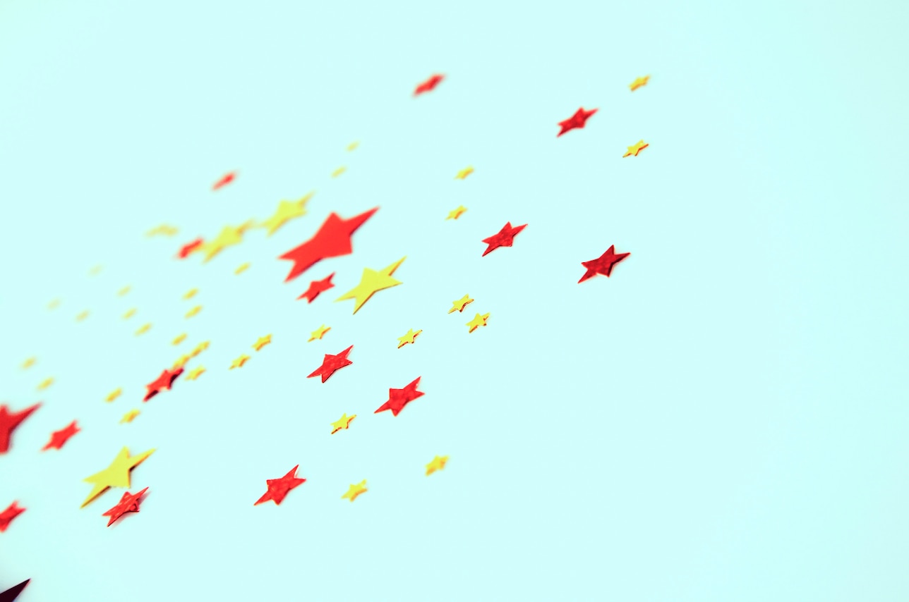 red and yellow stars scattered on turquoise background