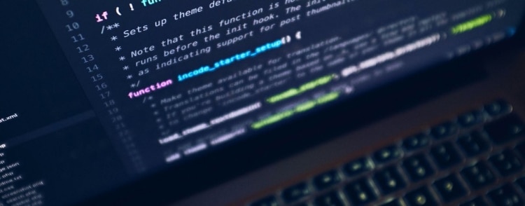 Close up and artisically blurred shot of Java code on an Mac laptop.